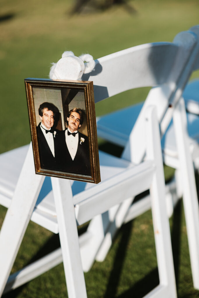 Photo of lost loved one draped over chair at wedding ceremony