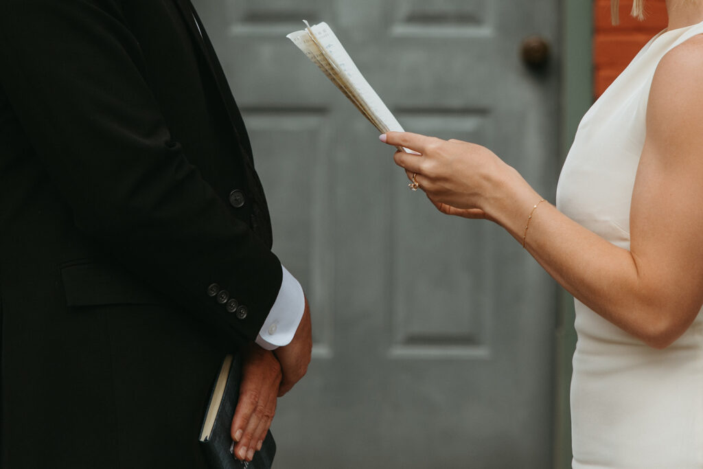 Bride holds handwritten vows