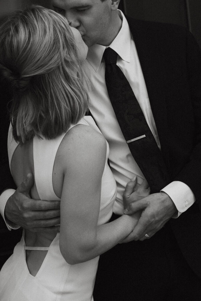 Bride and groom kiss in courthouse wedding