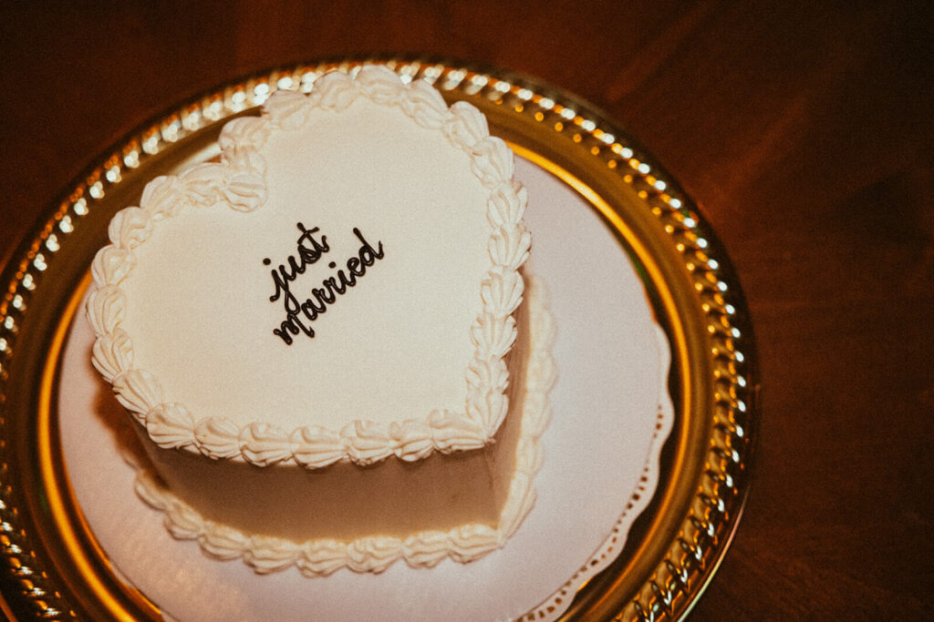 Vintage and heart-shaped 'Just Married' cake at courthouse wedding