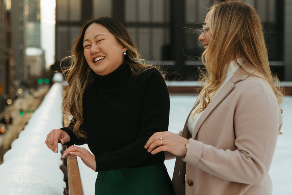 Woman laughs as her fiance comes up from behind and surprises her in Nashville mini-moon photoshoot. 