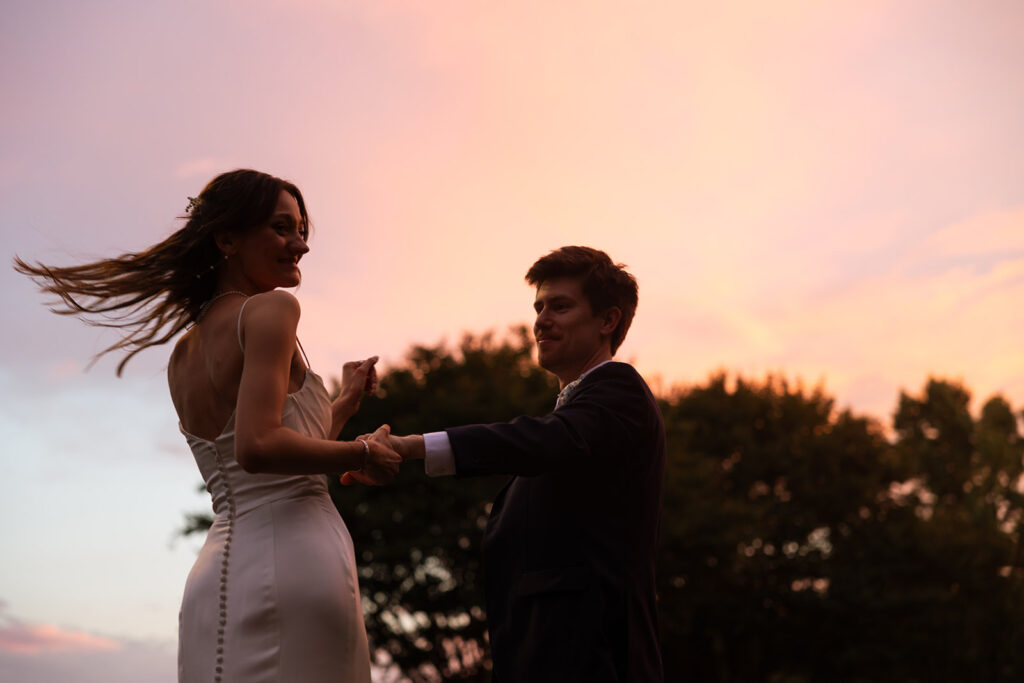 Bride and groom dance under Tennessee sunet 