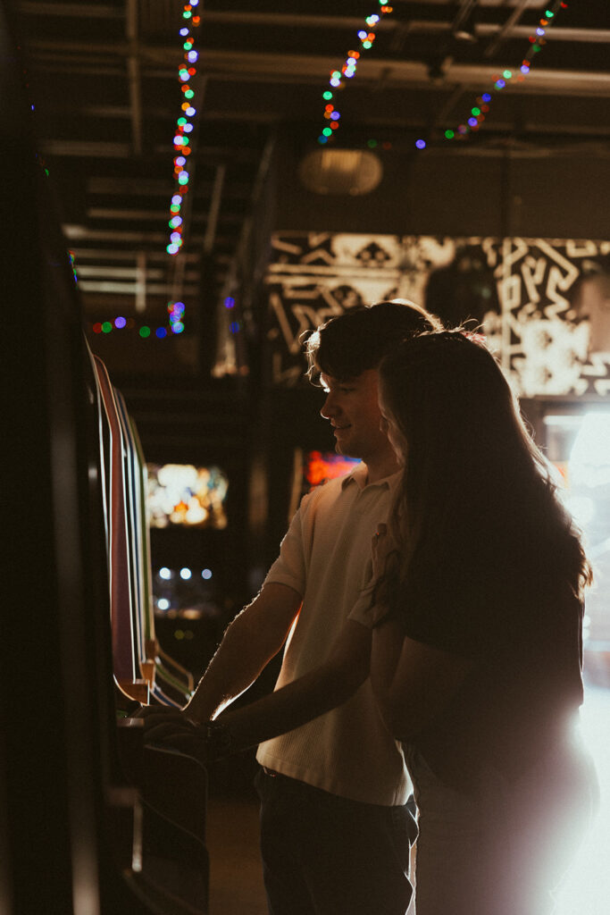 Engaged couple plays arcade games at Up Down in Nashville