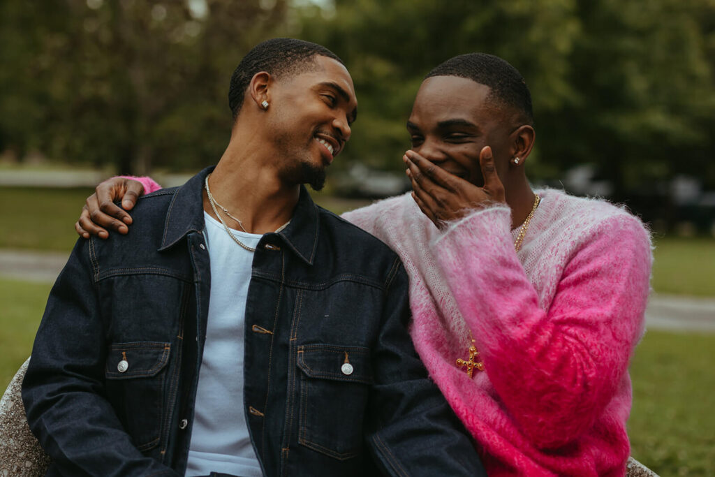 Couple laughs together on park bench before Nashville proposal