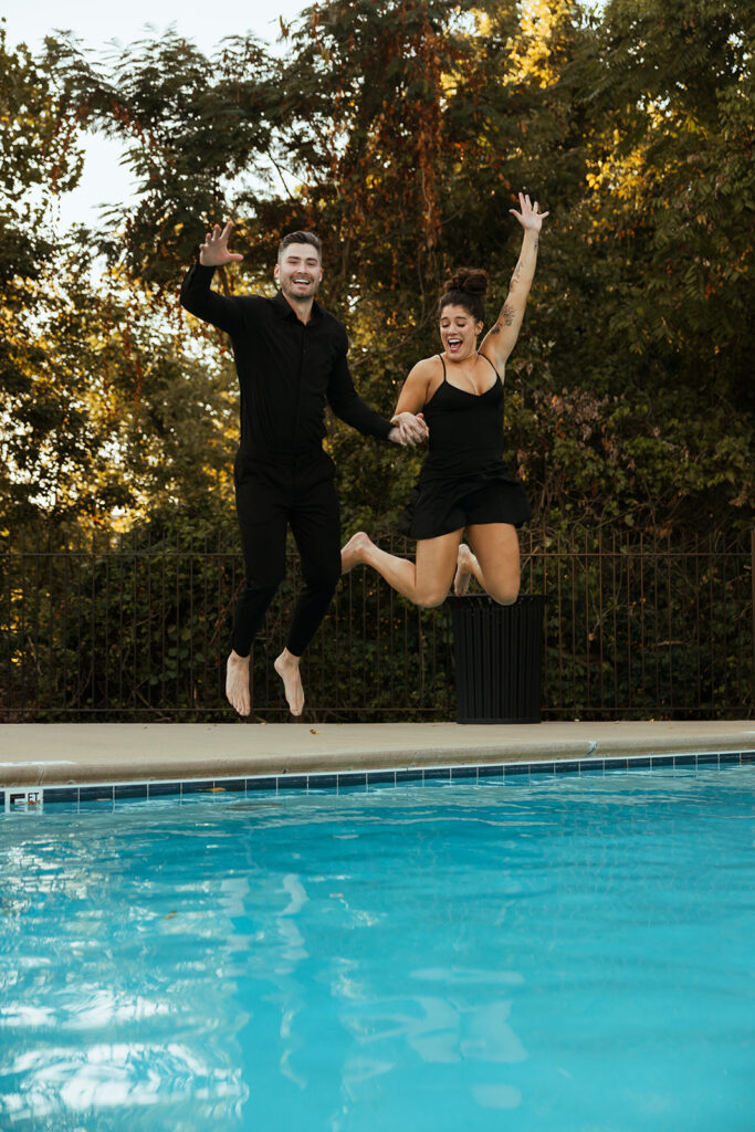 Engaged couple jumps into the pool