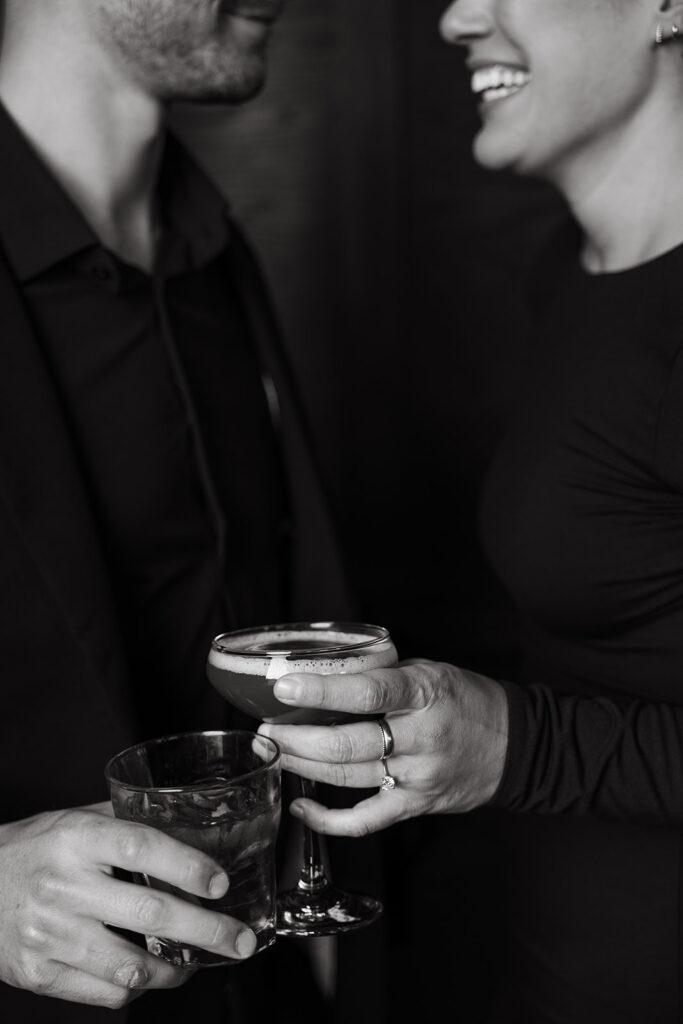 Engaged couple holds cocktails at Never Never in Wedgewood-Houston neighborhood in Nashville, Tennessee