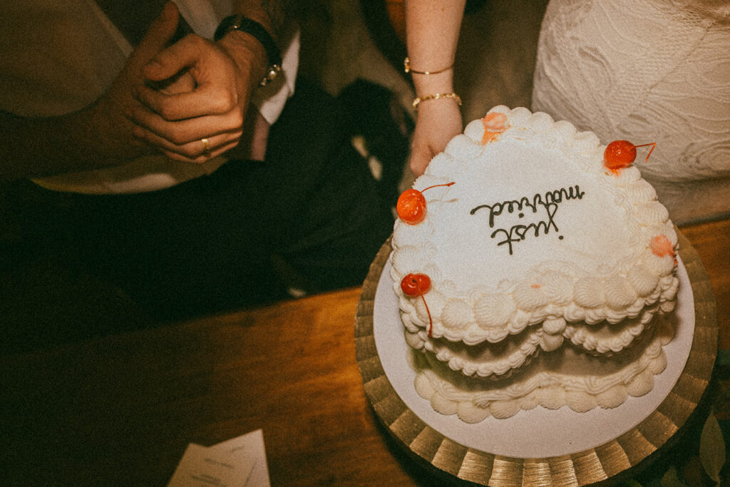 Bride and groom cut vintage-inspired wedding cake at wedding venue in Tennessee