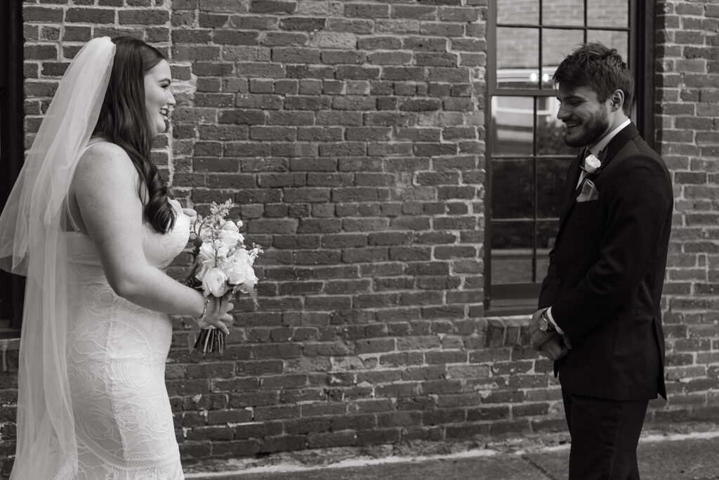 Groom takes in his bride during their first look 