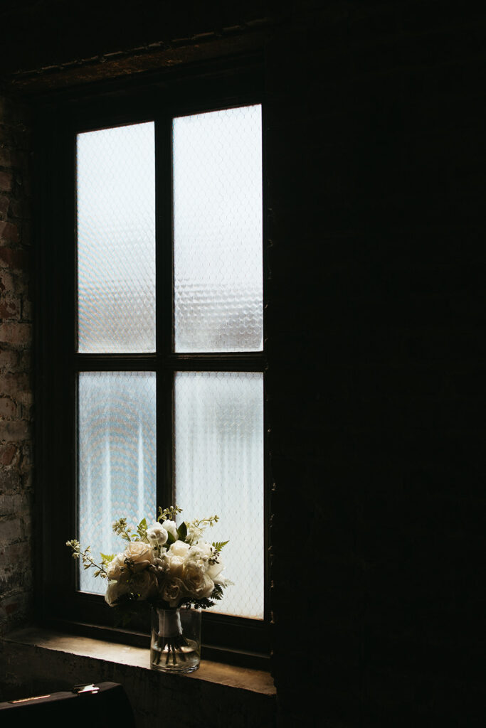 Bridal bouquet sits in the daylight flow 