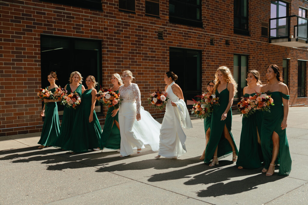 Brides and their bridal party walk through the streets of downtown Minneapolis