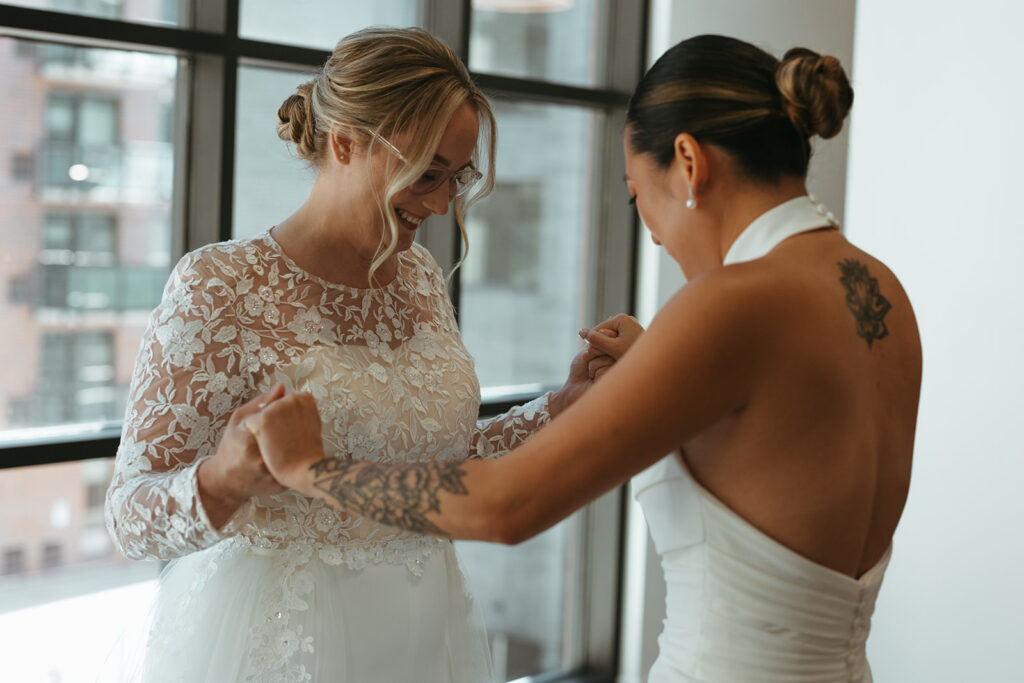 Brides take in each other's appearances during emotional first look 