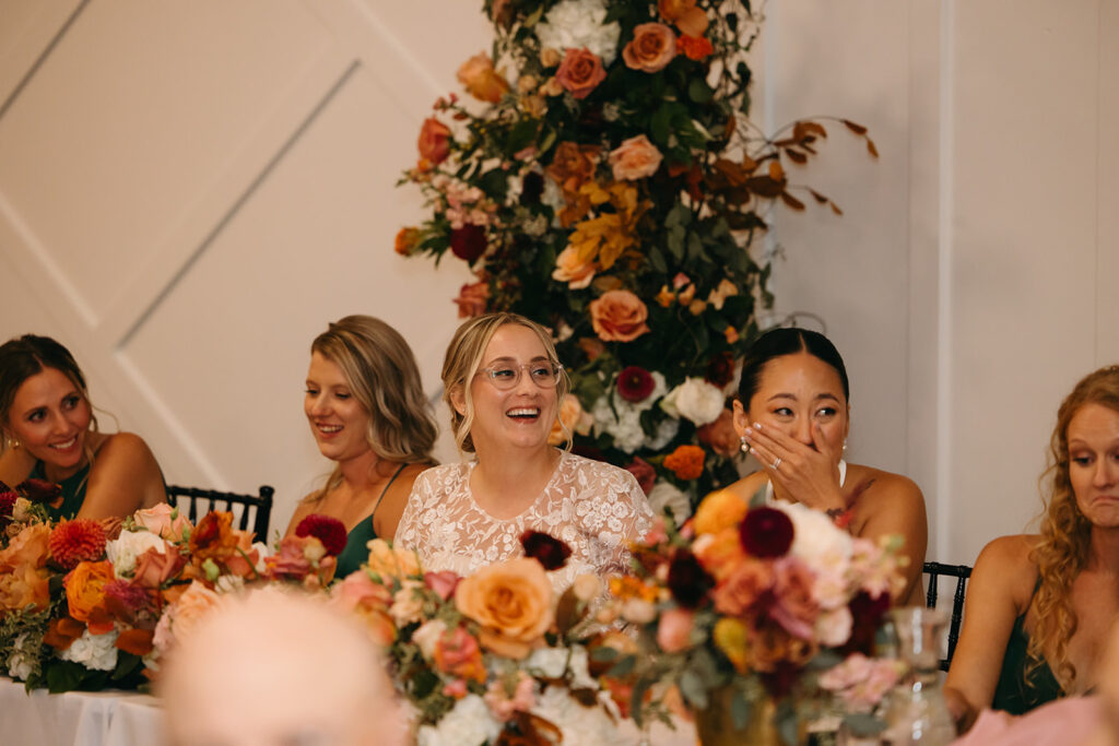 Brides smile and cry simultaneously as they listen to speeches