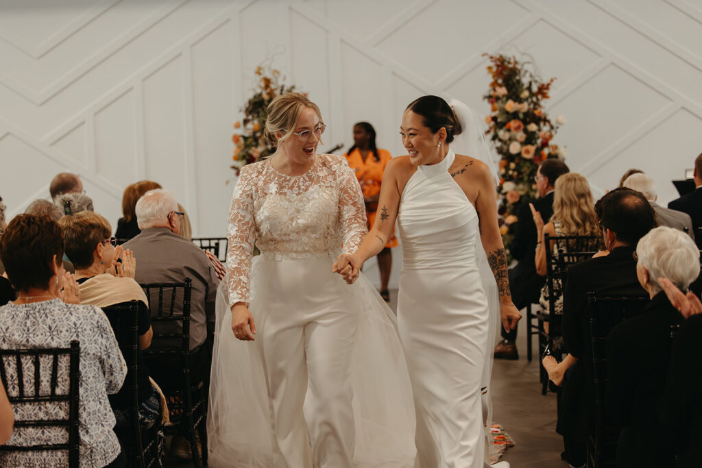 Queer brides walk down the aisle after saying I do in Minneapolis