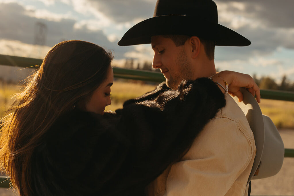 Engaged couple stands in Montana golden hour the night before their wedding. 