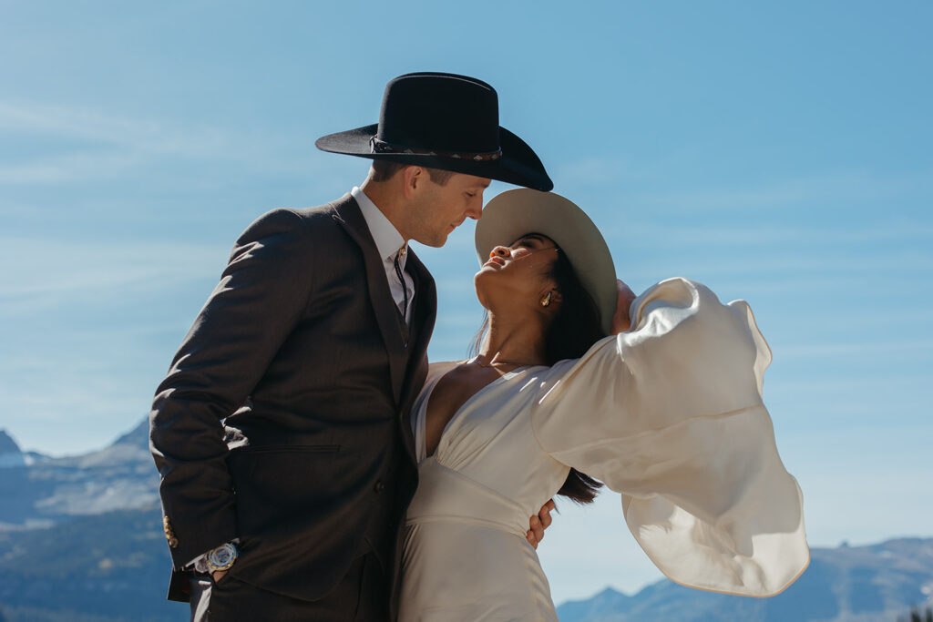 Bride and groom look deeply into each other's eyes in Glacier National Park for Yellowstone wedding in Montana.