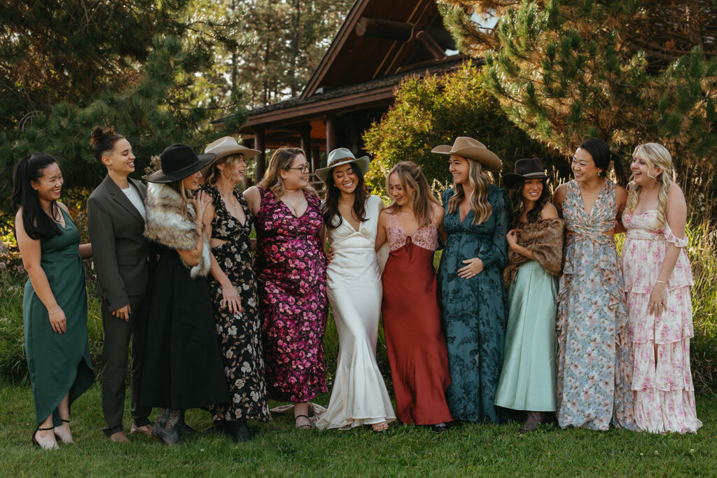 Bride and her friends pose together in their Yellowstone wedding attire. 