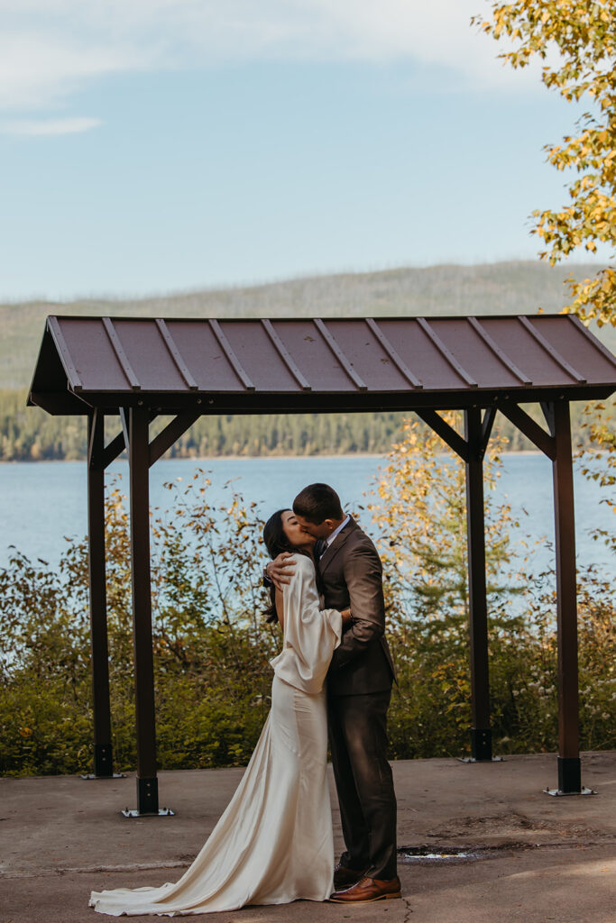 Bride and groom kiss in Montana amphitheater for their Yellowstone wedding.