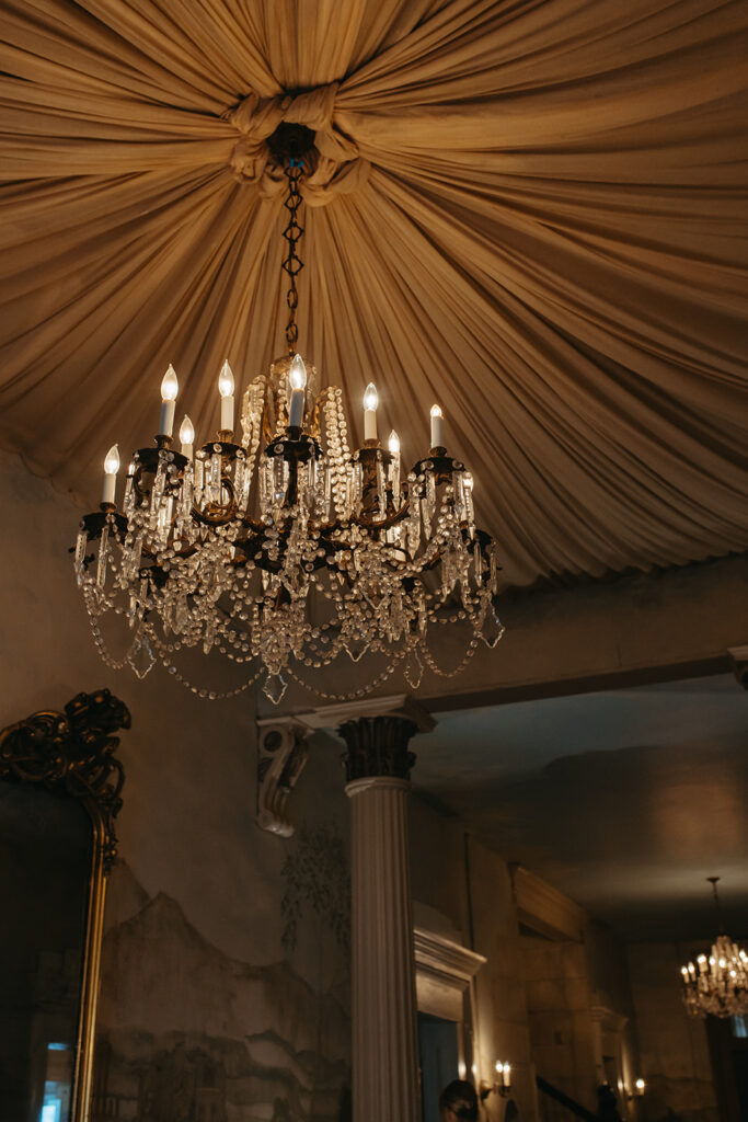 Elegant chandelier hangs from ceiling of historic wedding venue in Nashville