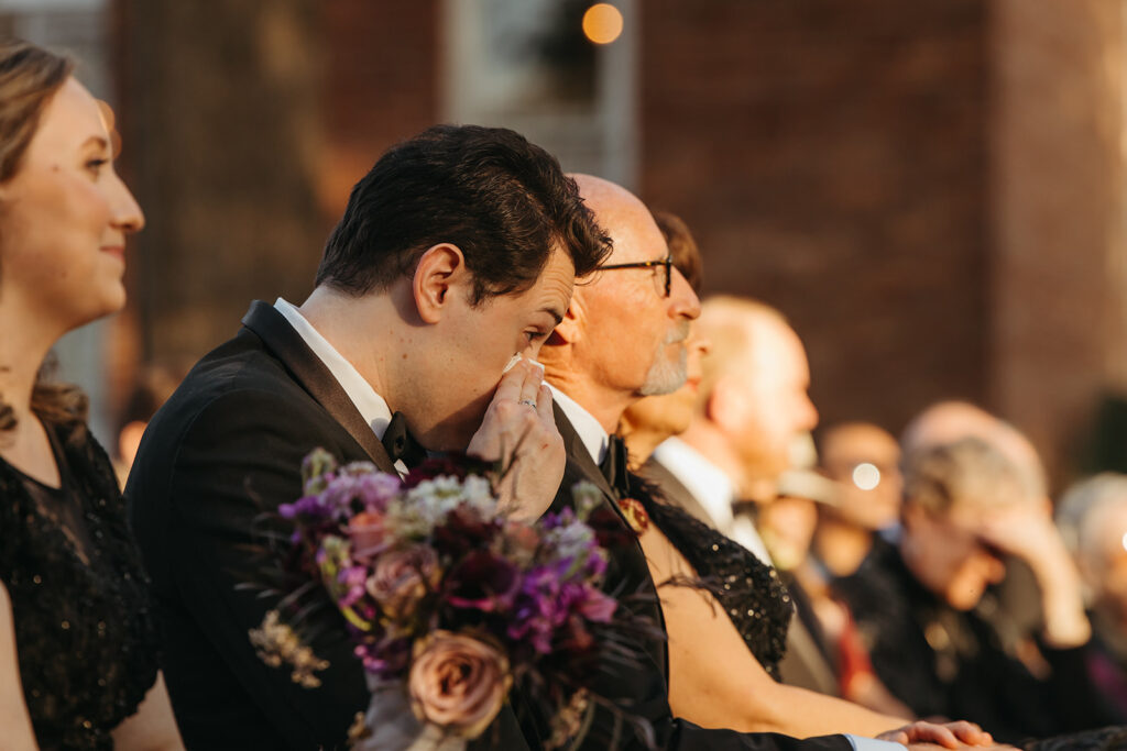 Wedding guest blows his nose during emotional wedding ceremony at black tie wedding in Nashville