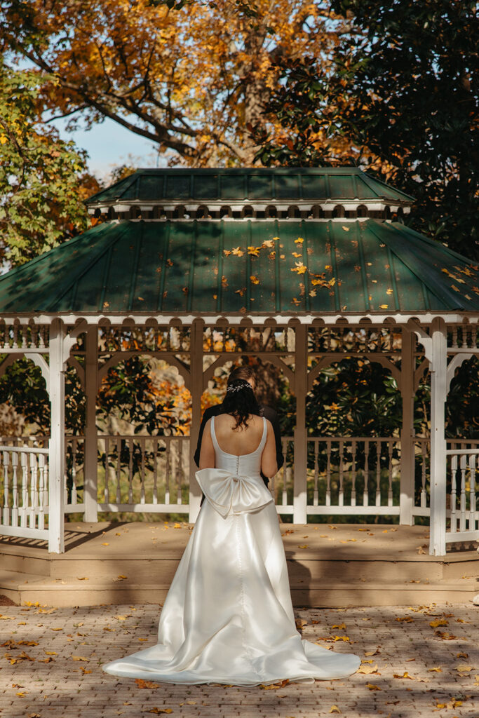 Bride walks towards groom for first look at black tie wedding in Nashville