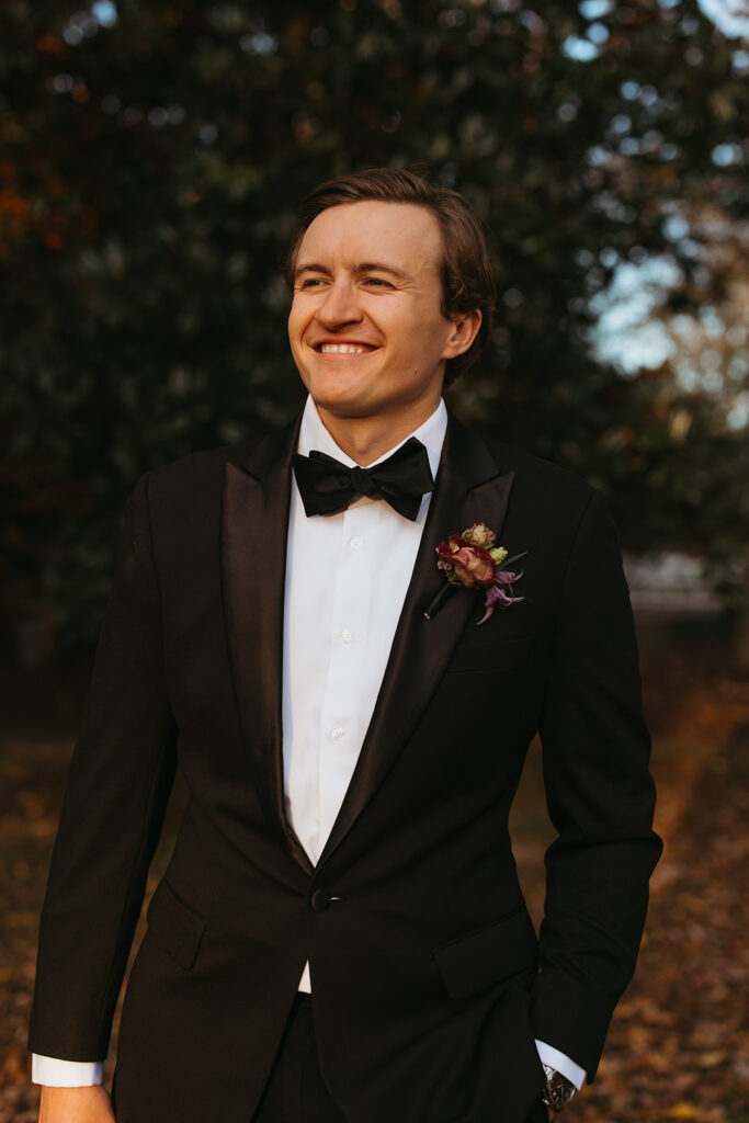 Groom smiles as his bride approaches