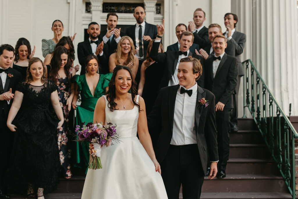 Newlyweds and their friends gather around steps of Riverwood Mansion in Nashville