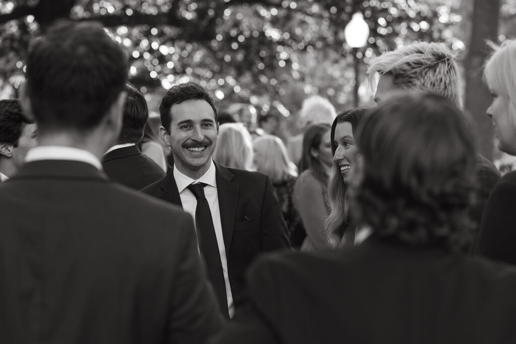 Wedding guests converse at black tie wedding in Nashville