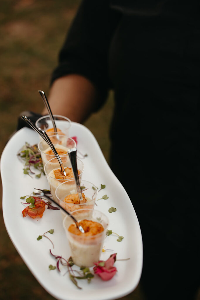 Waiter serves gorgeous platter of desserts