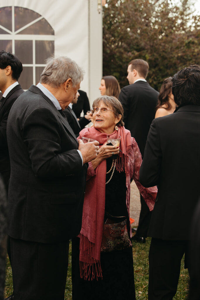 Wedding guests enjoy a beverage and conversation during Nashville wedding black tie cocktail hour