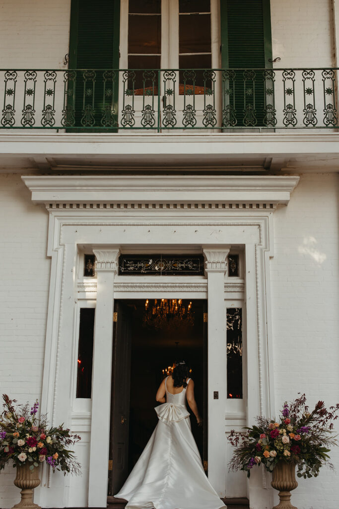 Bride walks through door of historic wedding venue in Nashville.