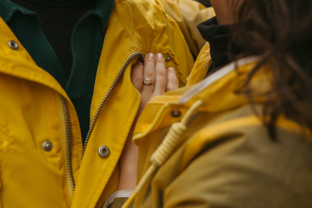 Woman lays her hand on her fiance's chest