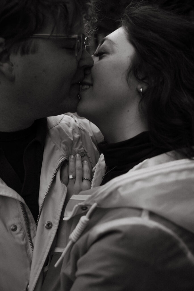 Engaged couple kisses romantically in downtown Nashville rain