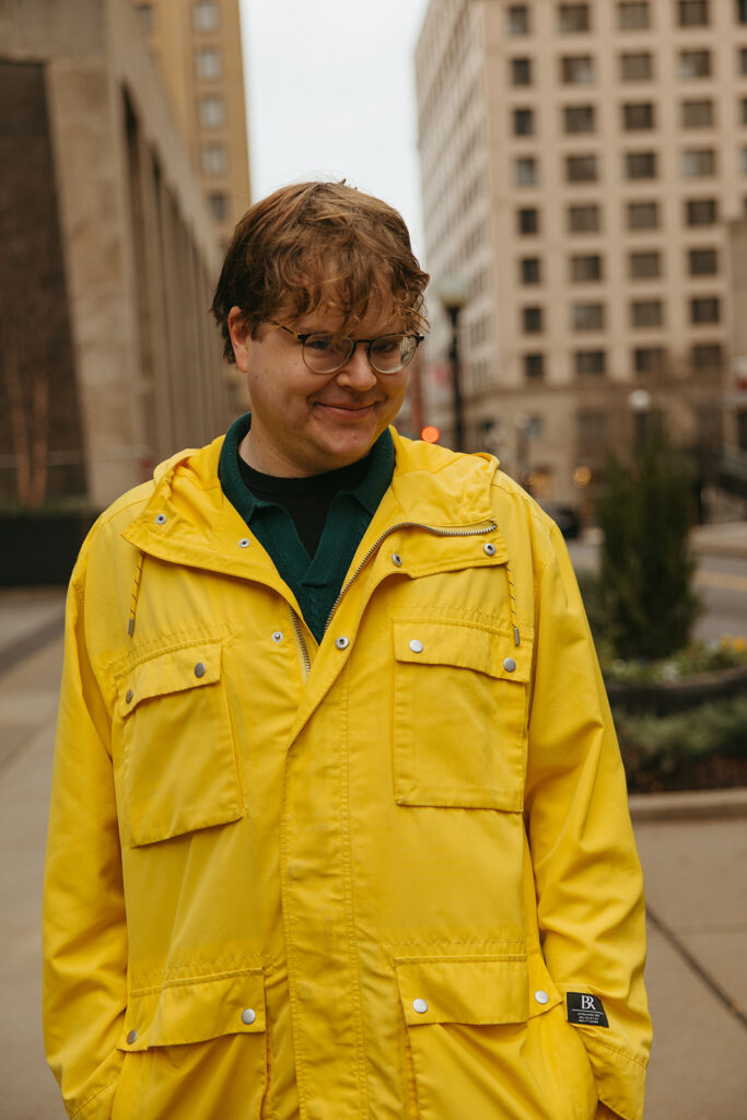 Cinematic engagement photo of man wearing yellow rainjacket