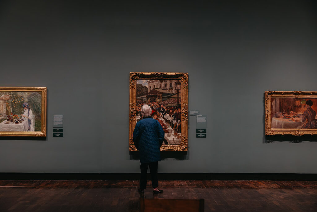 Man looks at artwork at exhibition in Frist Art Museum in downtown Nashville