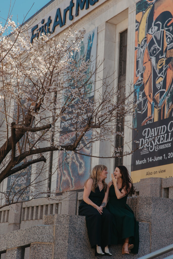 Couple sits on bench outside Frist Art Museum