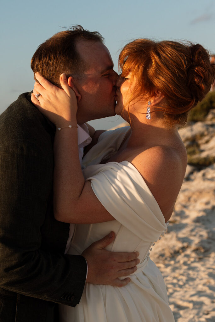 Bride and groom share joyful kiss at destination wedding in Mexico