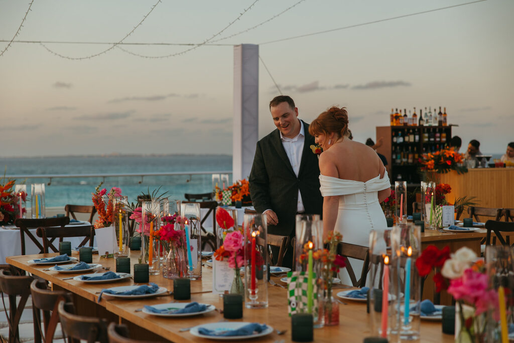 Bride and groom take in their beautiful tablescapes before the rest of the guests arrive to the reception