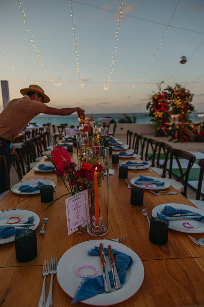 Colorful wedding reception tablescapes at sunset