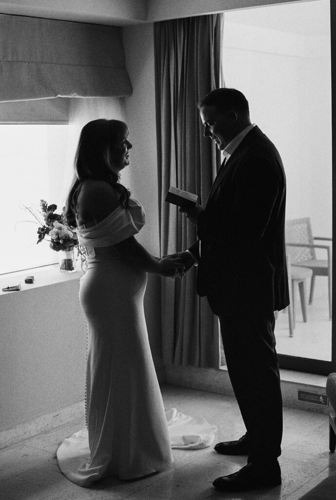 Groom reads vows during quiet, private moment for the newlyweds