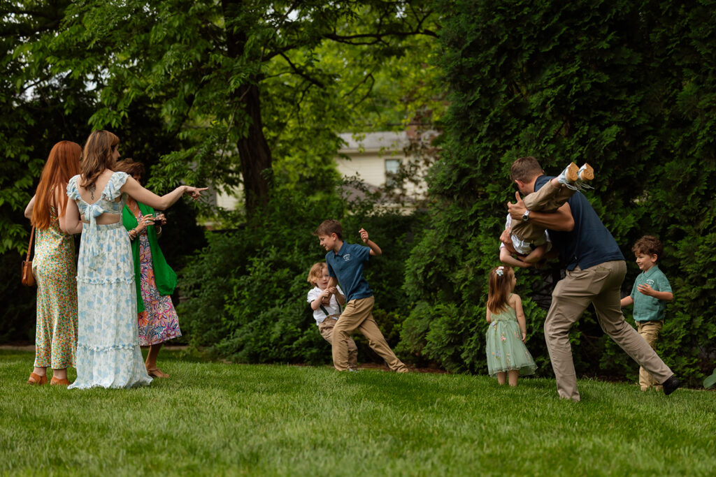 Parents and children dancing and playing on the grass during a joyful at-home wedding in Nashville