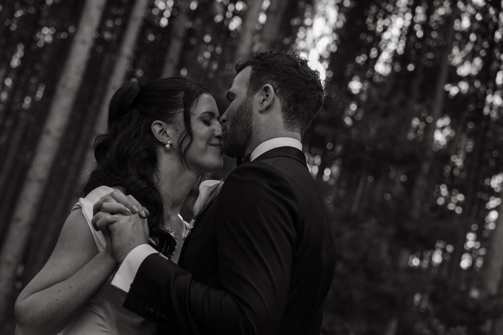 Forest kiss at golden hour—soft, cinematic, completely them for posed wedding photography.