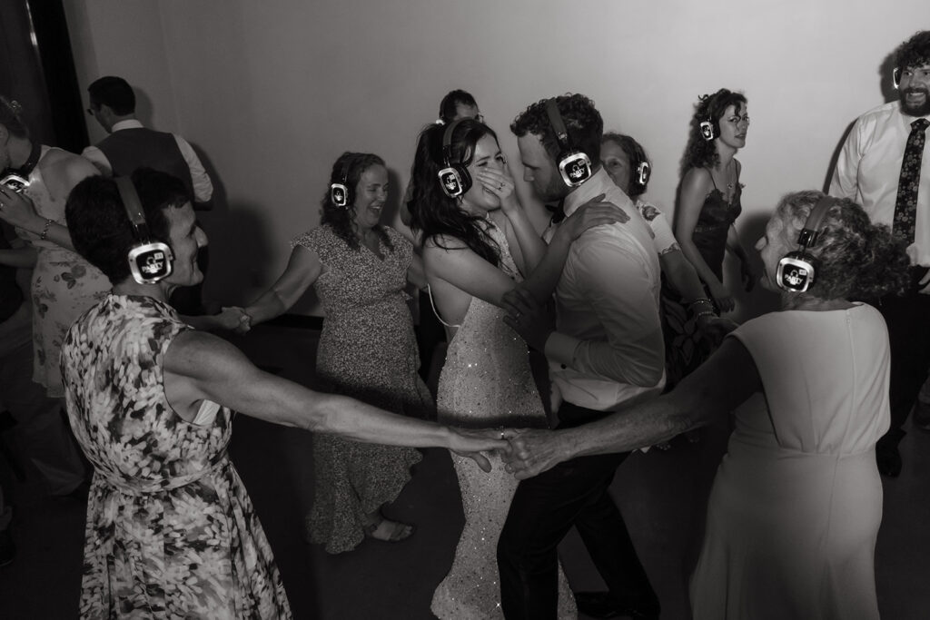 Guests wear silent disco headphones, dancing and laughing together long past midnight.