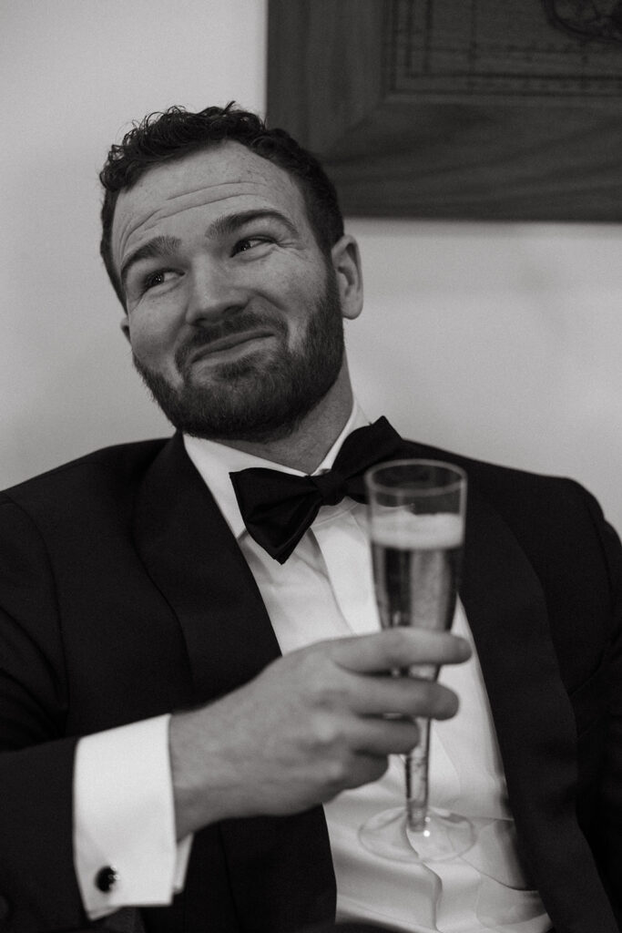 Champagne in hand, groom portraits that actually feel like him.