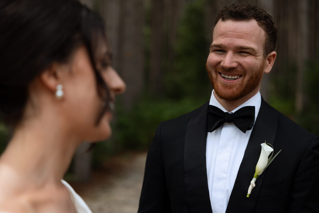A laugh caught between glances during their posed wedding photography portraits.
