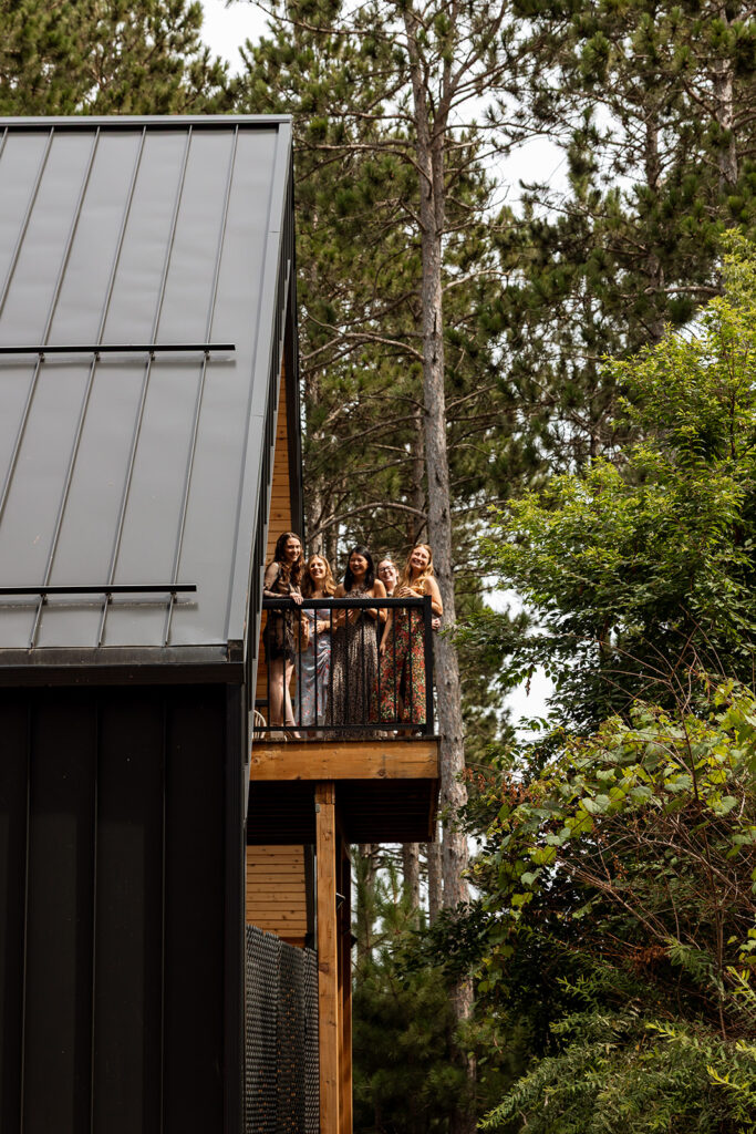 Guests leaning over the balcony, watching the first look.