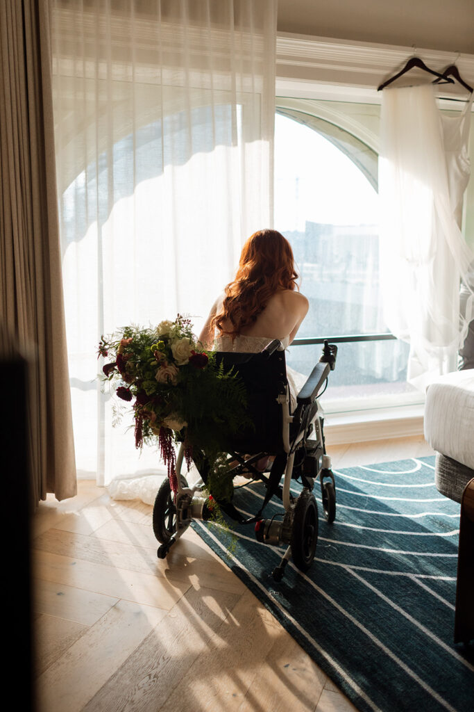 Fiona Cauley sits in her wheelchair in the sunlight during the calm before her wedding ceremony.