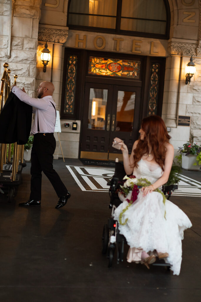 Comedian Fiona Cauley looks back at her husband while he hangs his suit jacket on a luggage cart outside Union Station in Nashville