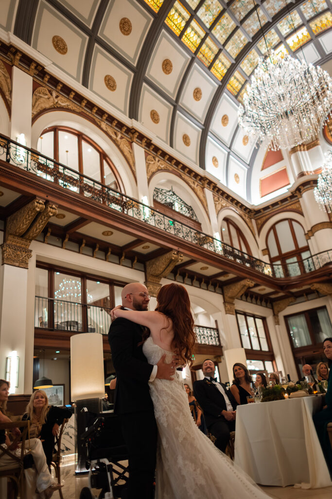 Documentary wedding photographer captures Fiona Cauley and husband Matt during their first dance at Union Station wedding in Nashville. 