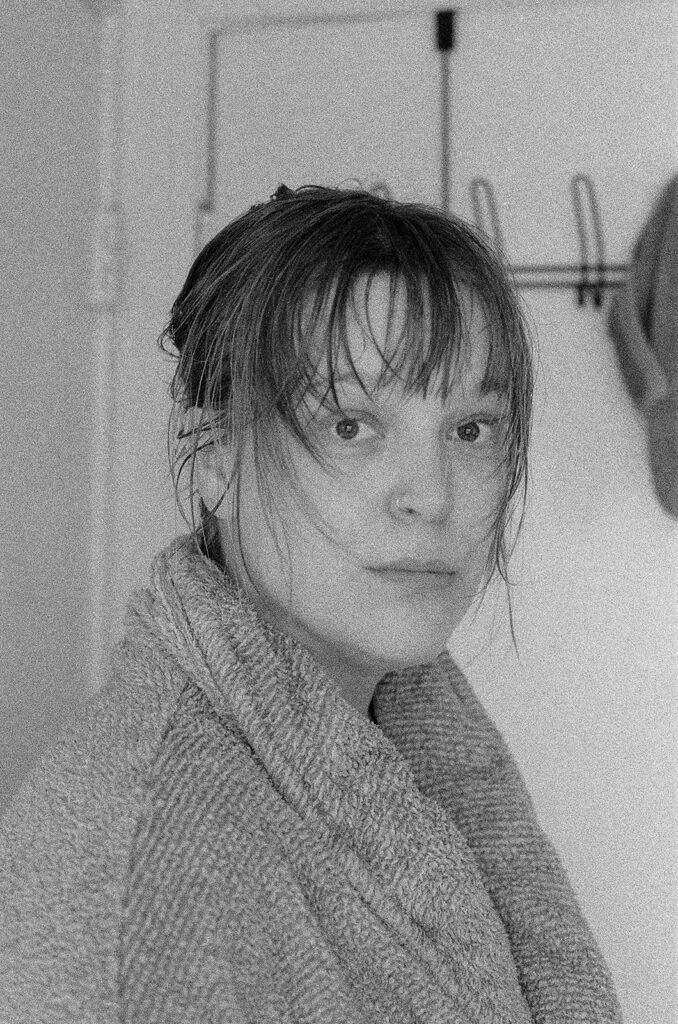 Documentary portrait of Nashville photographer Ali Miller after finishing her morning routine, photographed naturally inside her home.