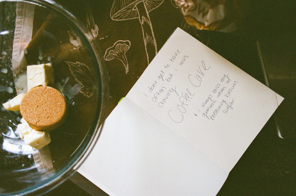 Close-up of a handwritten coffee cake recipe and baking ingredients photographed as part of Ali Miller's documentary branding session.